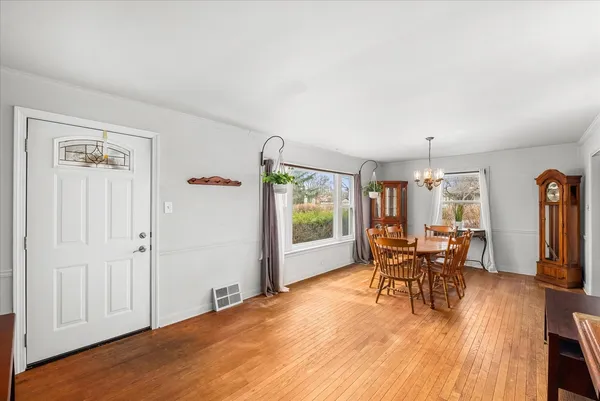 a view of a livingroom with furniture window and wooden floor
