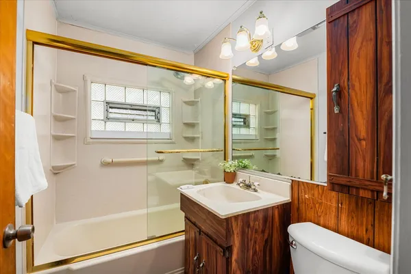 a bathroom with a sink a mirror and a shower