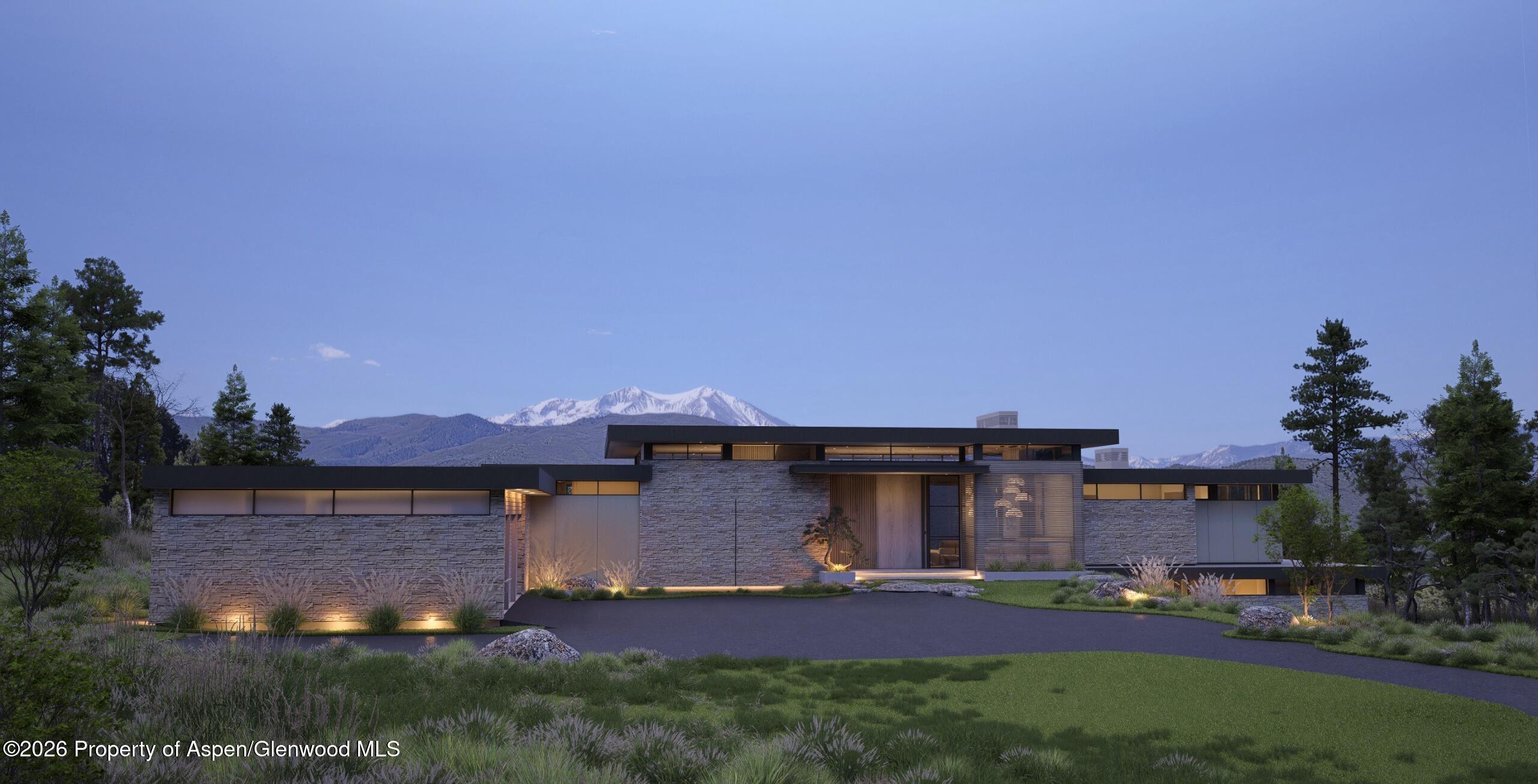 a front view of a house with a yard and street