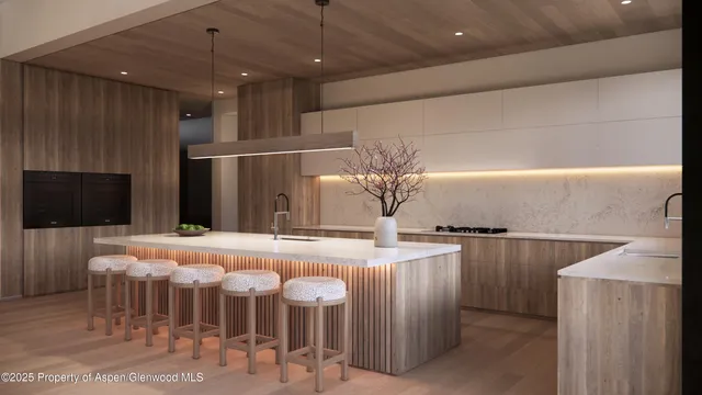 a kitchen with kitchen island granite countertop a table and chairs in it