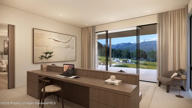 a view of a workspace with furniture and a window