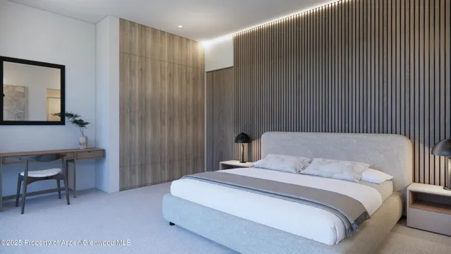 a bedroom with a bed and a table in it