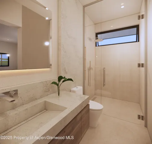 a bathroom with a bathtub shower sink and toilet