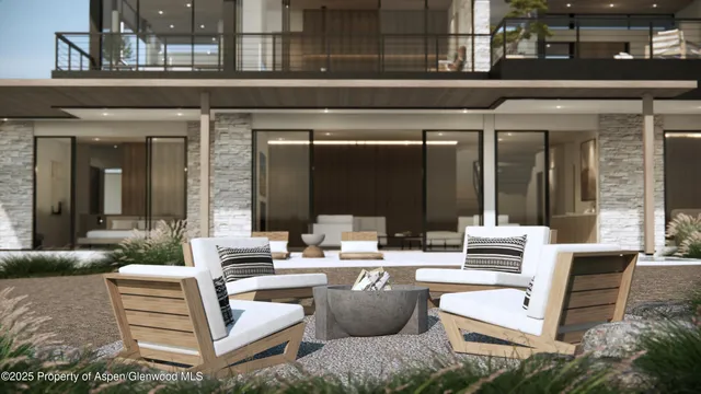 a view of a patio with couches table and chairs and potted plants