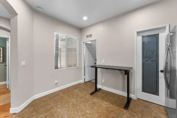 a view of an empty room with a fireplace