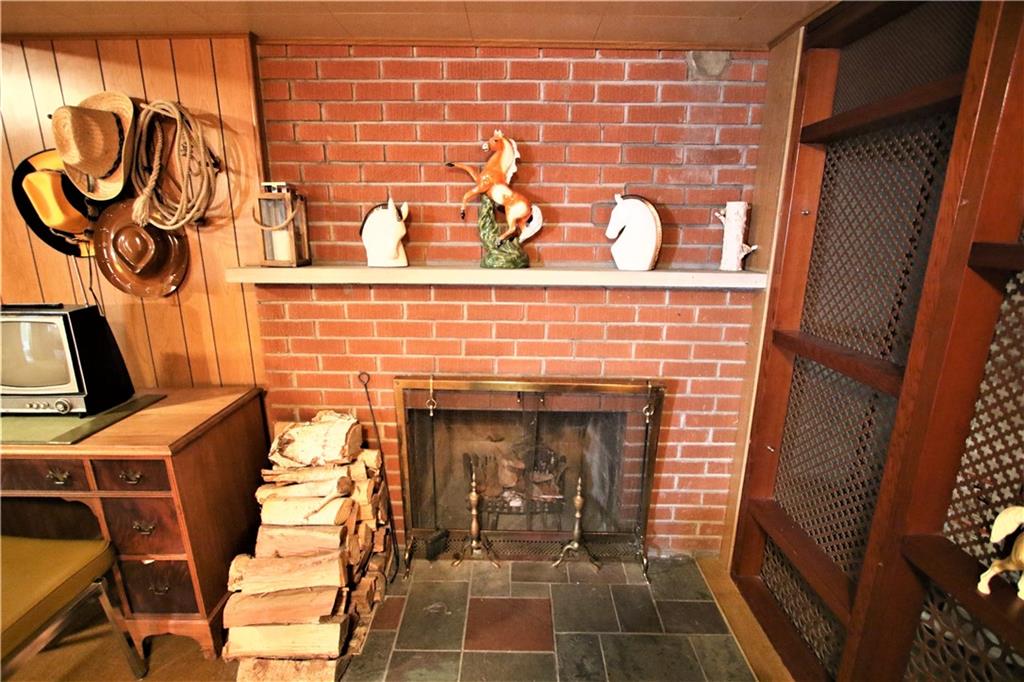 157 Taylor Run Road Monongahela, PA 15063 - Photo 20 of 42 View of Wood Burning Brick Fireplace w/ Slate Base & Concrete Mantle in Lower Level Family Room