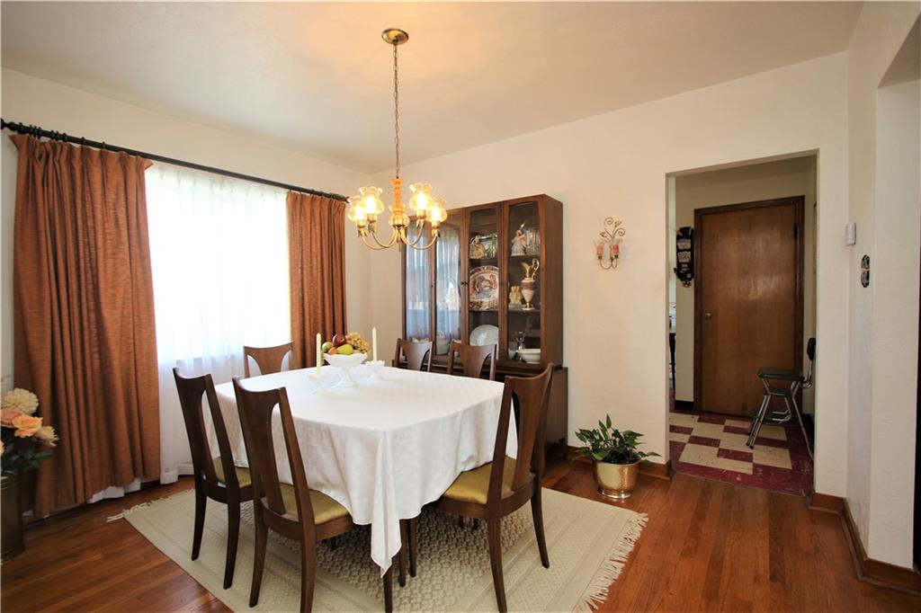 157 Taylor Run Road Monongahela, PA 15063 - Photo 5 of 42 Separate 12x10 Formal Dining Room w/ Hardwood Floors, Elegant Light Fixture and another Large Picture Window allowing the Natural Light to Flow through the Home effortlessly and enjoy the Breathtaking Sunrises & Sunsets against the Majestic Mountain Views