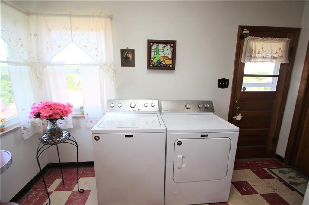 157 Taylor Run Road Monongahela, PA 15063 - Photo 8 of 42 Washer & Dryer included in Sale and currently hooked up in Kitchen for Convenience of a 1st Floor Laundry (also hookups downstairs). Door to Side 6x5 Covered Porch w/ New Awning July 2023. Also to the right is the Door to the Garage to bring groceries directly into Kitchen.