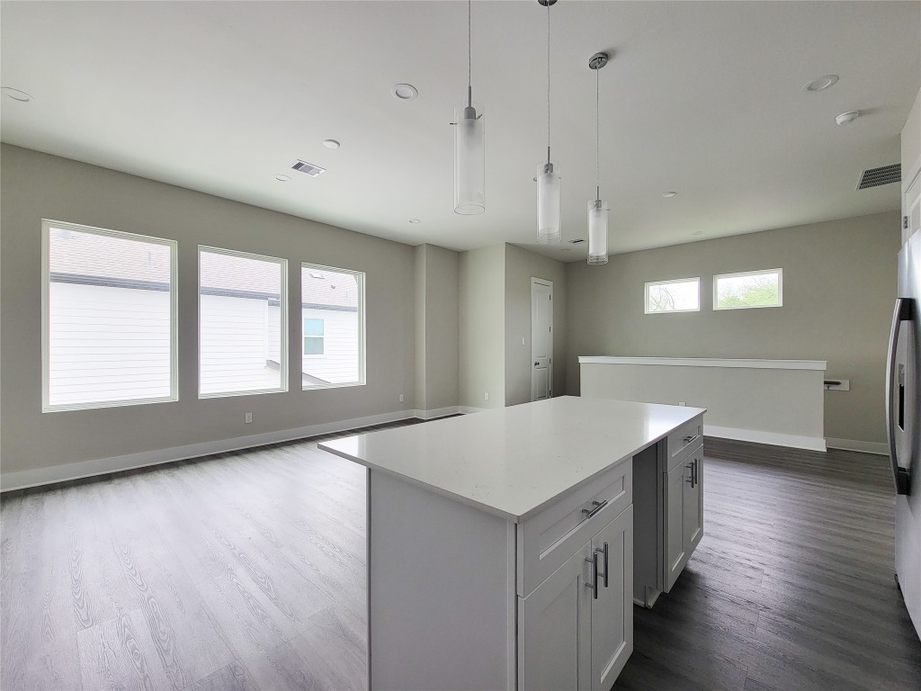 8316 Curry Road, Unit A Houston, TX 77093 - Photo 30 of 47 a room with a chandelier and wooden floors