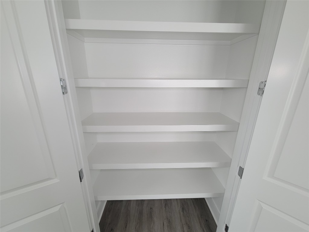 8316 Curry Road, Unit A Houston, TX 77093 - Photo 33 of 47 a view of walk in closet with empty racks