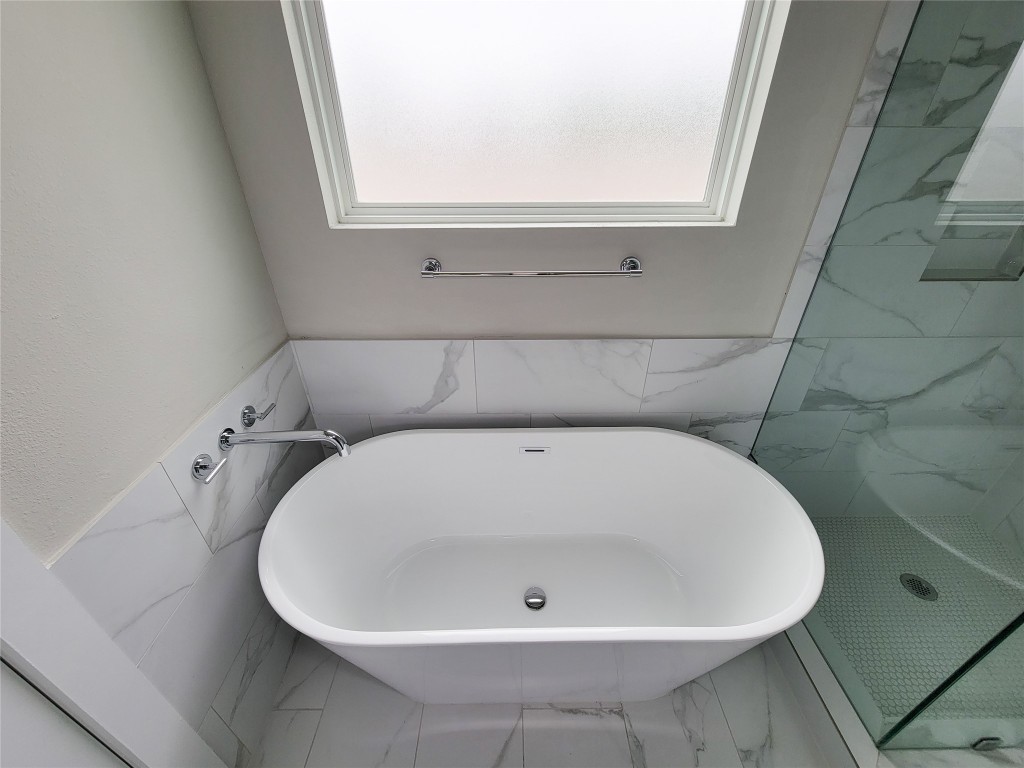 8316 Curry Road, Unit A Houston, TX 77093 - Photo 40 of 47 a white bath tub sitting in a bathroom