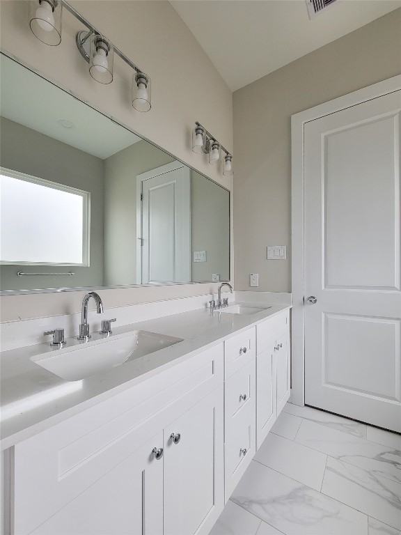 8316 Curry Road, Unit A Houston, TX 77093 - Photo 42 of 47 a bathroom with a double vanity sink and a mirror