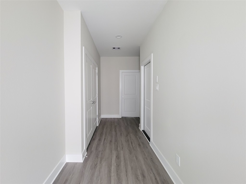 8316 Curry Road, Unit A Houston, TX 77093 - Photo 5 of 47 a view of a hallway with wooden floor