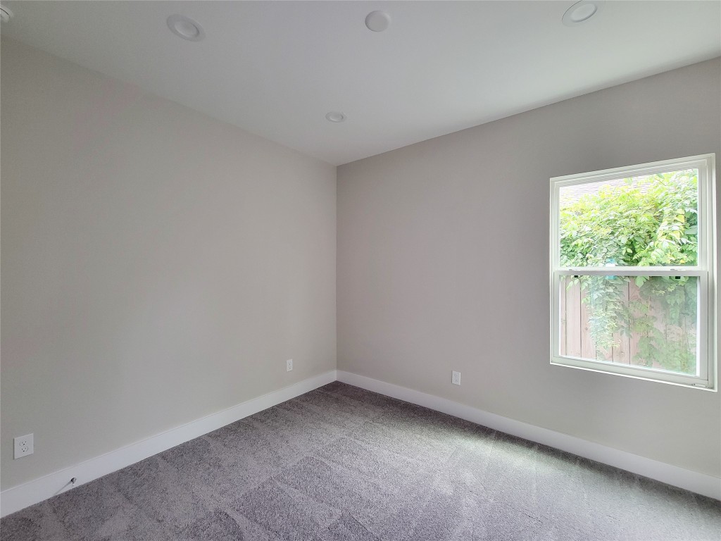 8316 Curry Road, Unit A Houston, TX 77093 - Photo 6 of 47 an empty room with a window