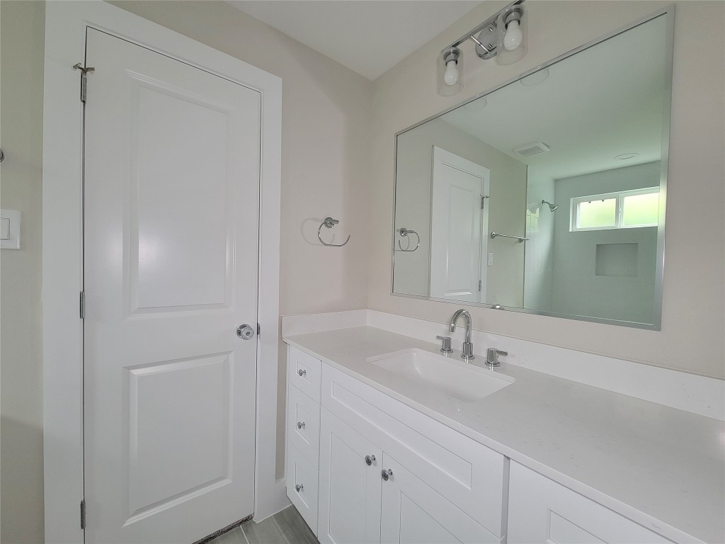 8316 Curry Road, Unit A Houston, TX 77093 - Photo 8 of 47 a bathroom with a sink and a mirror