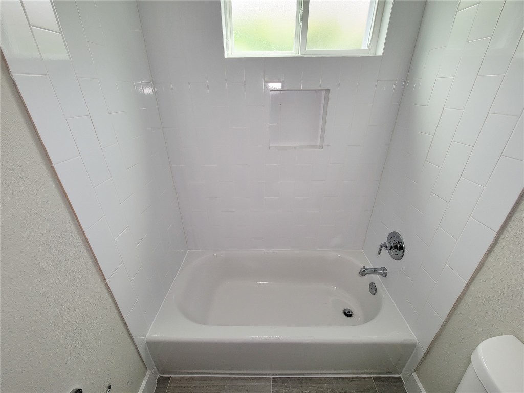 8316 Curry Road, Unit A Houston, TX 77093 - Photo 9 of 47 a bathroom with a bathtub
