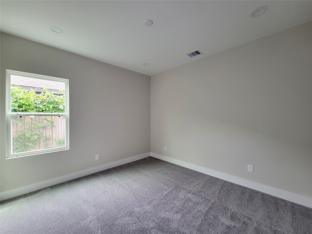 8316 Curry Road, Unit A Houston, TX 77093 - Photo 10 of 47 an empty room with a window