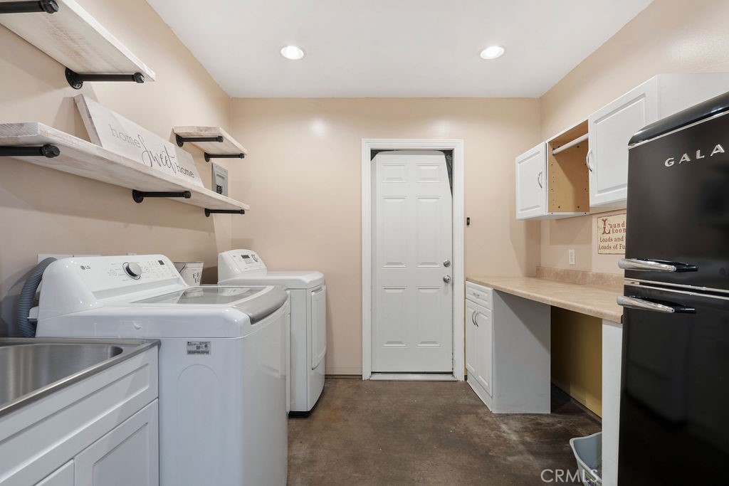 1338 Delay Avenue Glendora, CA 91740 - Photo 23 of 46 a utility room with cabinets washer and dryer