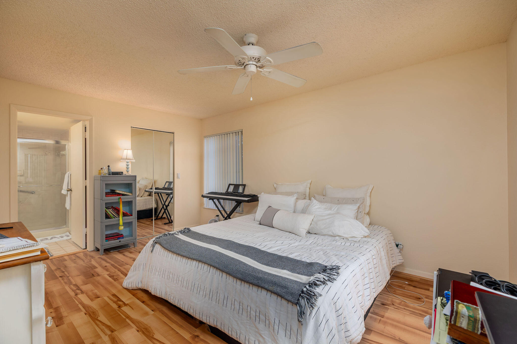 2500 Southeast Anchorage Cove, Unit D3 Port St. Lucie, FL 34952 - Photo 17 of 51 a bedroom with a large bed and a chandelier