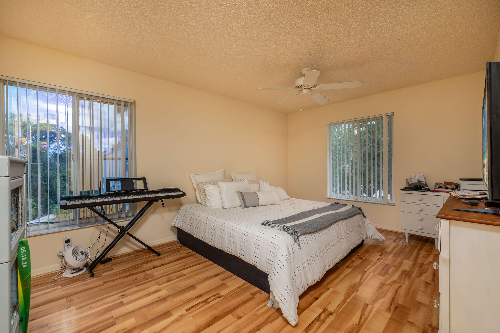 2500 Southeast Anchorage Cove, Unit D3 Port St. Lucie, FL 34952 - Photo 18 of 51 a bedroom with a bed and wooden floor