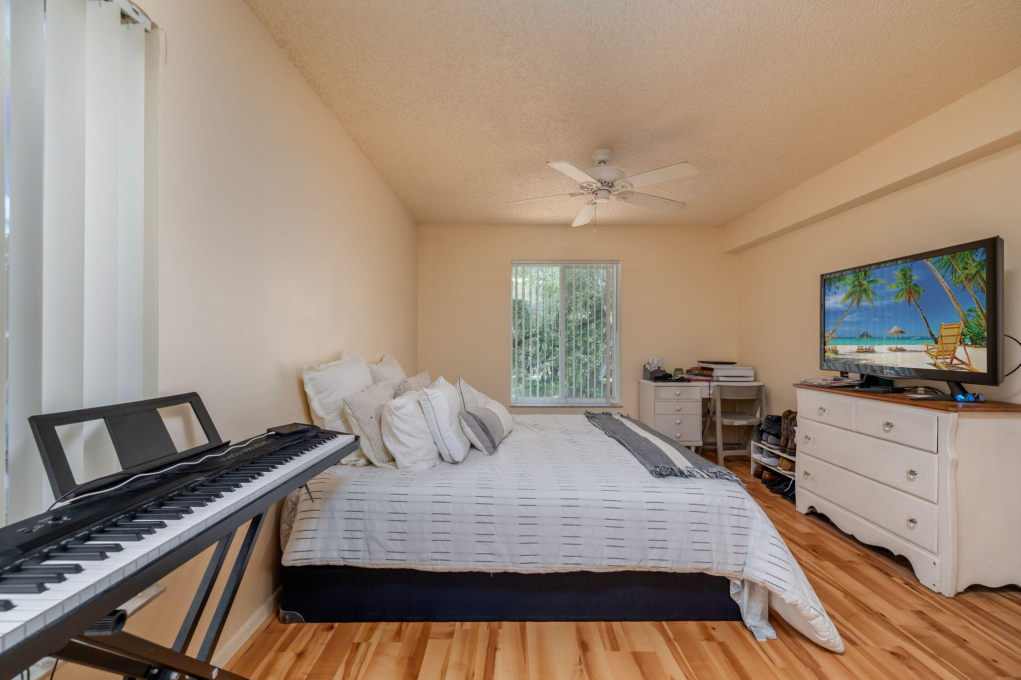 2500 Southeast Anchorage Cove, Unit D3 Port St. Lucie, FL 34952 - Photo 19 of 51 a bedroom with a bed and a flat screen tv