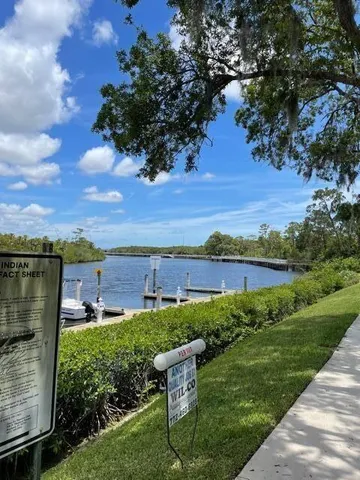 a view of a lake with a house in the background