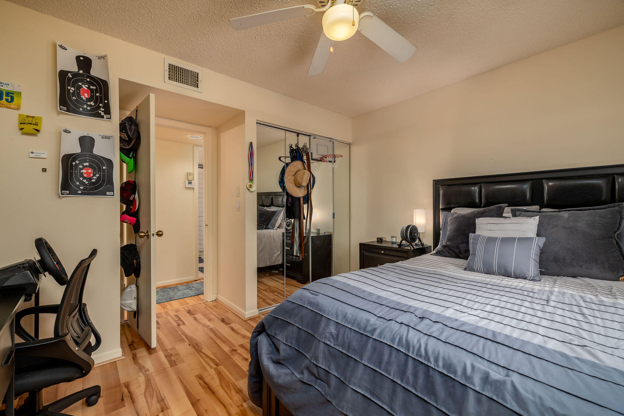 2500 Southeast Anchorage Cove, Unit D3 Port St. Lucie, FL 34952 - Photo 21 of 51 a bedroom with a bed and a chandelier