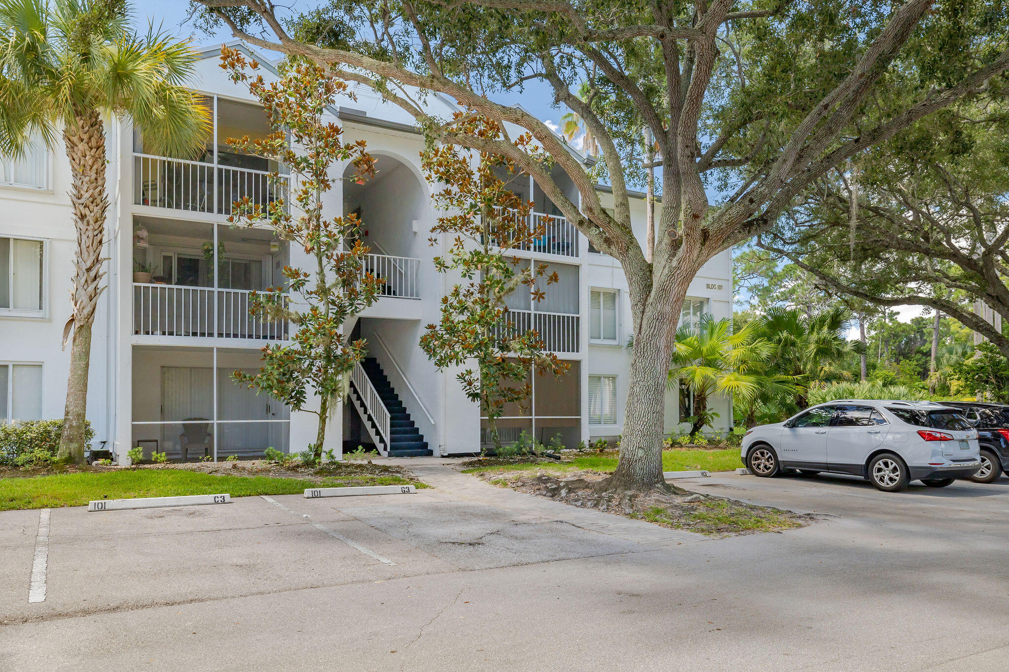 2500 Southeast Anchorage Cove, Unit D3 Port St. Lucie, FL 34952 - Photo 32 of 51 a view of a parked cars in front of a building