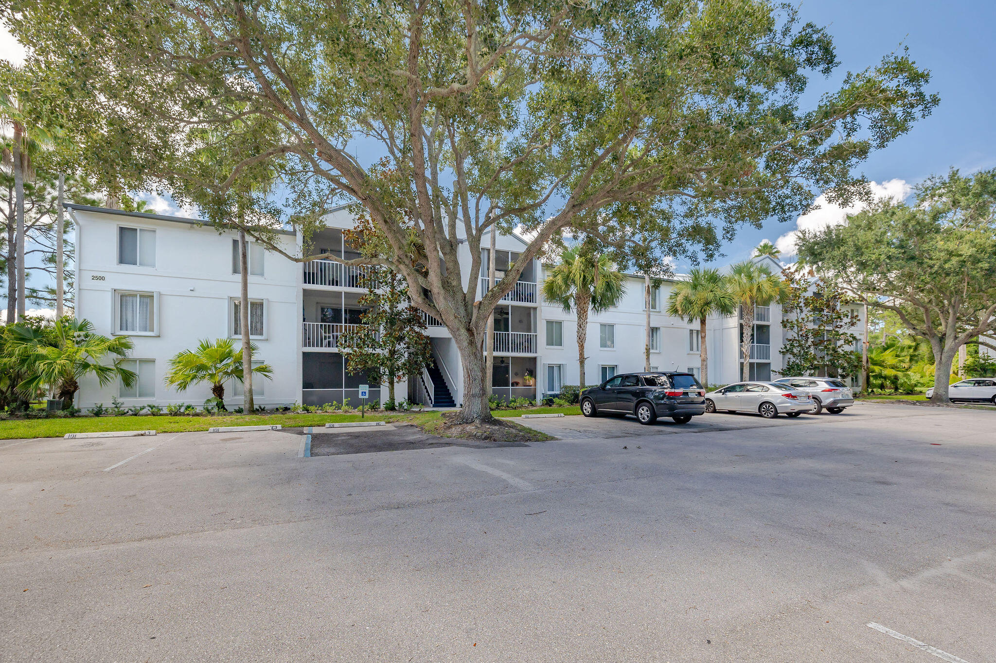 2500 Southeast Anchorage Cove, Unit D3 Port St. Lucie, FL 34952 - Photo 37 of 51 a view of a parked cars in front of a building