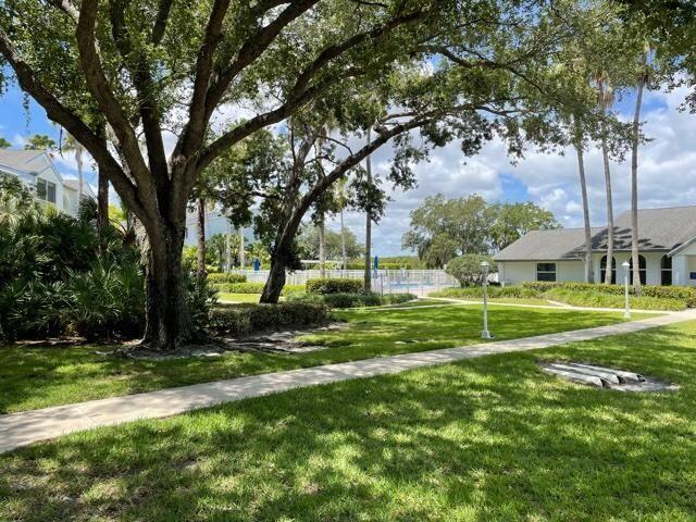 2500 Southeast Anchorage Cove, Unit D3 Port St. Lucie, FL 34952 - Photo 46 of 51 a view of a park with large trees