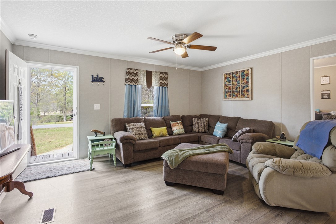 240 Southeast 147 Seneca, SC 29678 - Photo 6 of 27 This inviting living space features warm flooring and natural light.