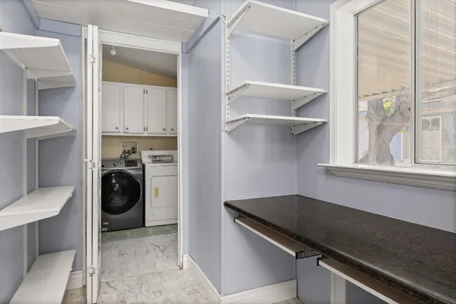a utility room with washer and dryer