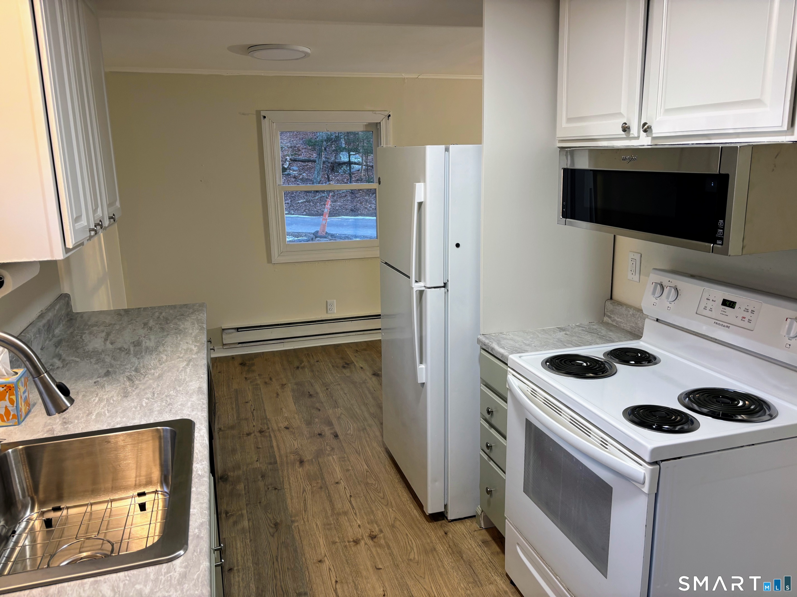 62 Rattling Valley Road Deep River, CT 06417 - Photo 4 of 19 a kitchen with a stove and a microwave