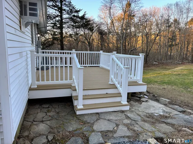 a view of a bench in the backyard