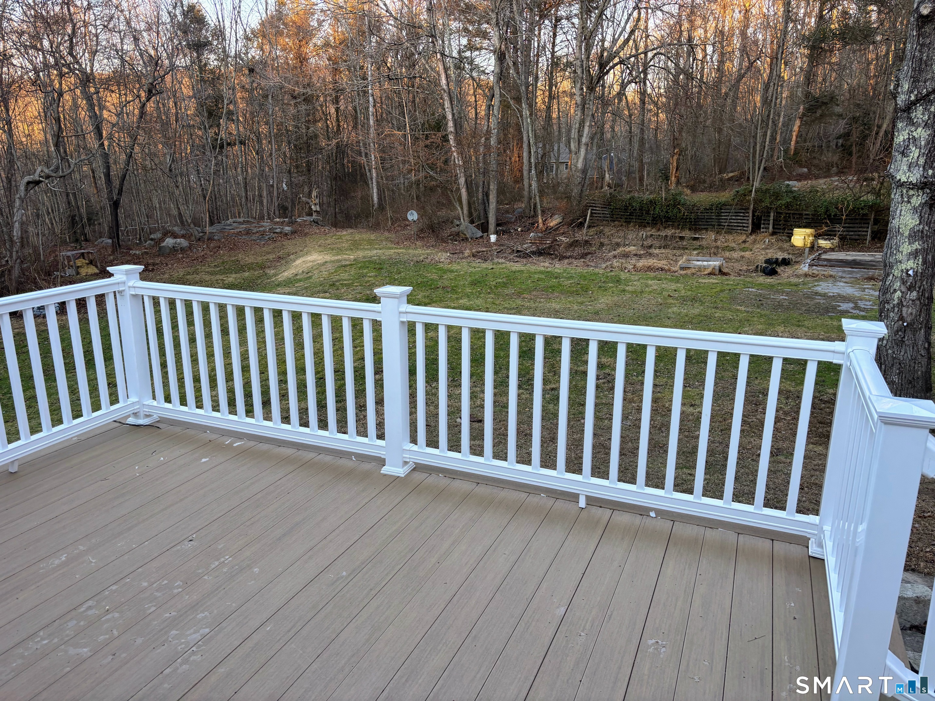 62 Rattling Valley Road Deep River, CT 06417 - Photo 6 of 19 a view of deck and trees with wooden fence