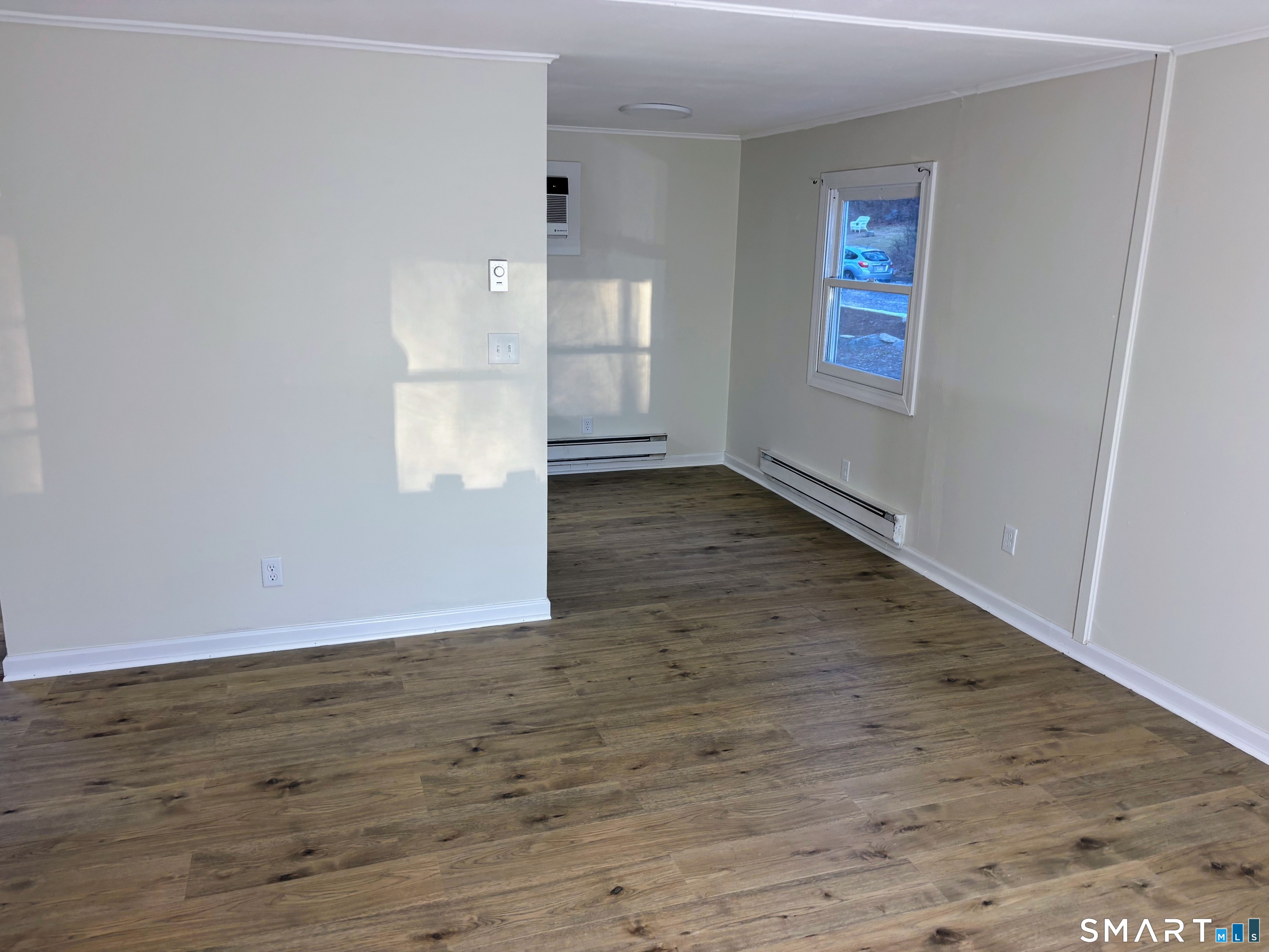 62 Rattling Valley Road Deep River, CT 06417 - Photo 8 of 19 an empty room with wooden floor and windows