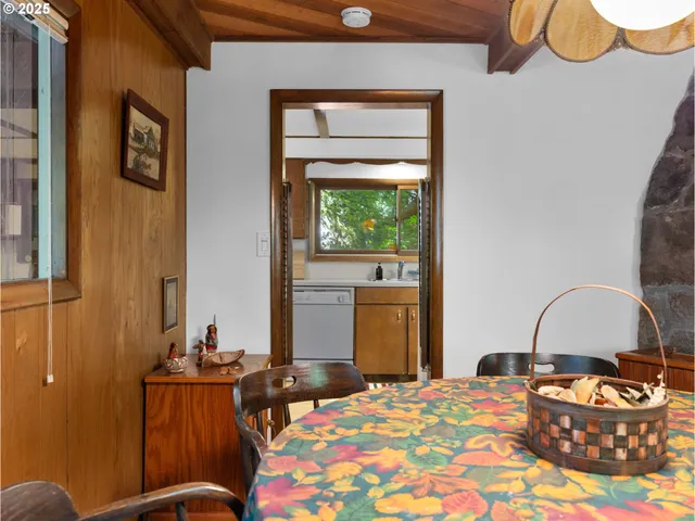 a bedroom with a bed and dresser with mirror