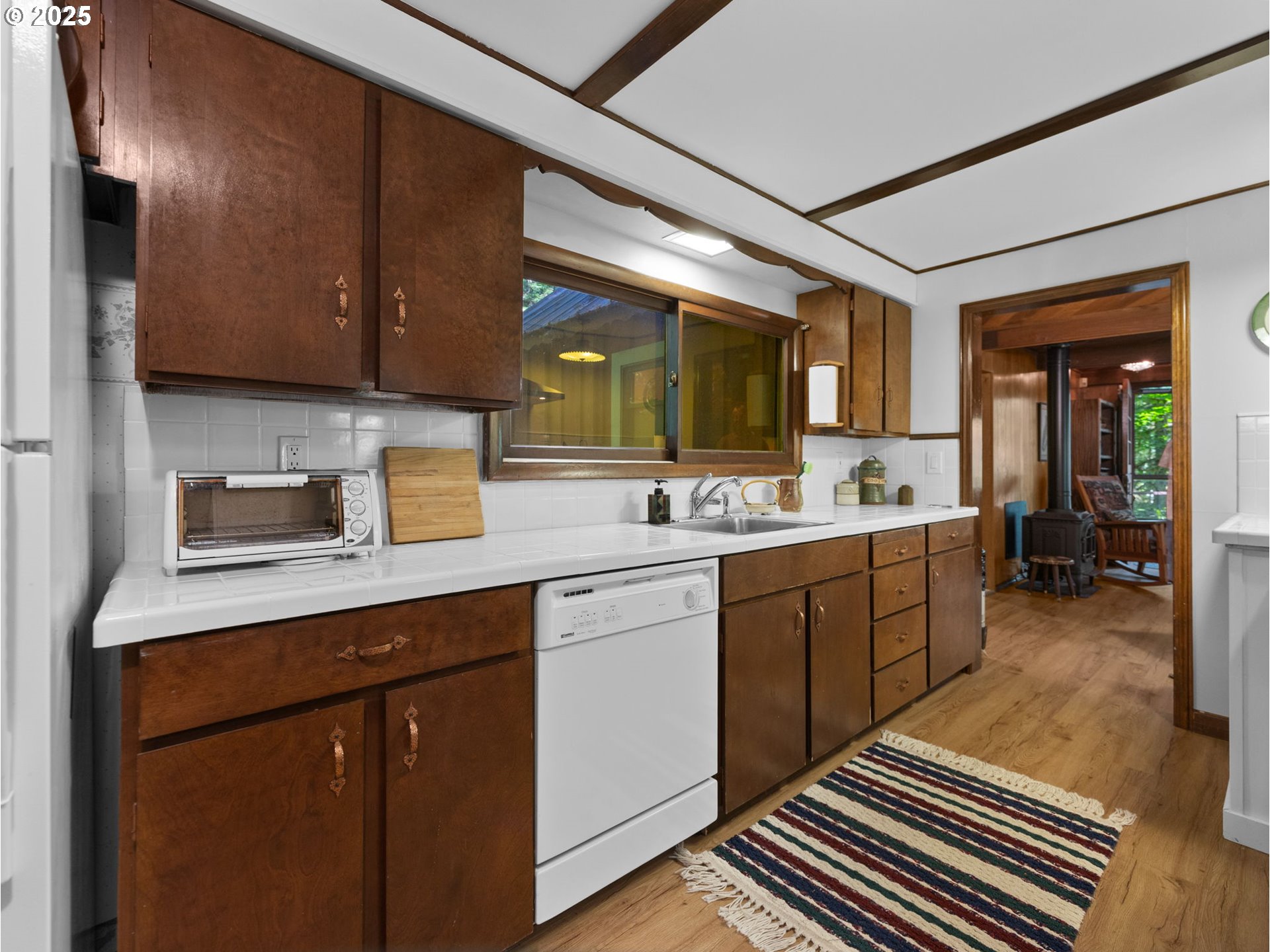 26811 East Road 15 Rhododendron, OR 97049 - Photo 15 of 47 a kitchen with sink cabinets and window