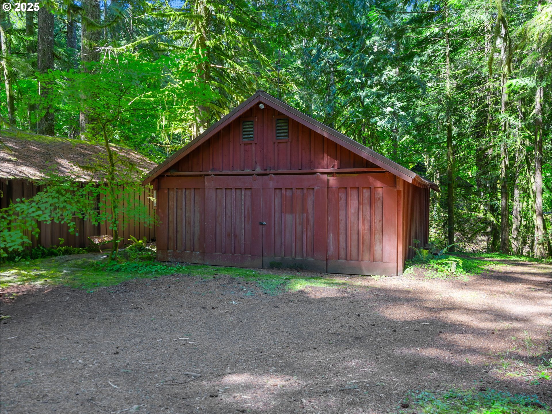 26811 East Road 15 Rhododendron, OR 97049 - Photo 30 of 47 a view of a barn in a yard with large trees
