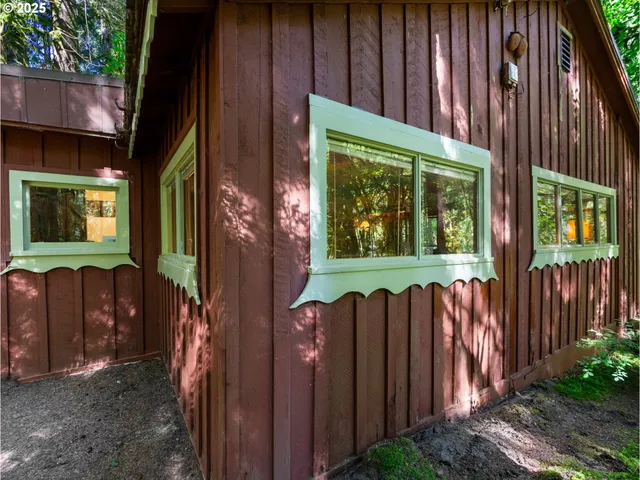 a view of a backyard with wooden fence
