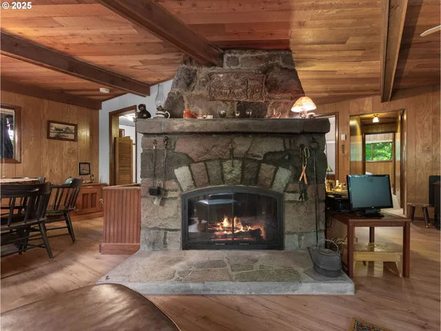 a room with fireplace and chair