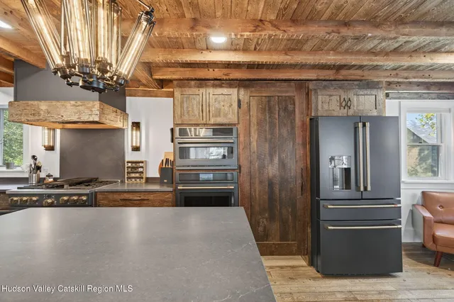 a kitchen with stainless steel appliances granite countertop a stove and a sink