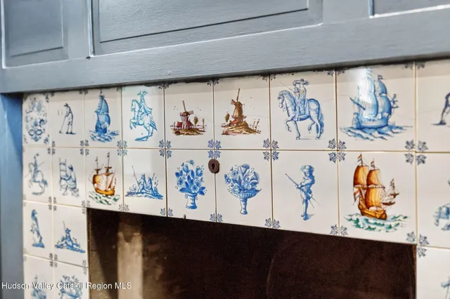 a bathroom with a granite countertop sink vanity and mirror