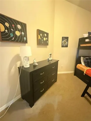 a bedroom with a bed and a couch