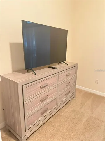 a room with furniture and flat screen tv