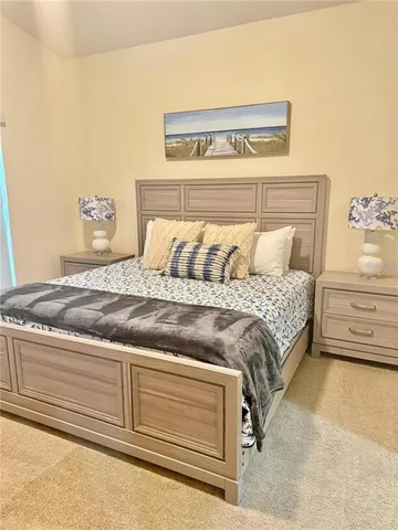 a white toilet sitting next to a white wall