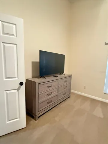 a wooden bench sitting in front of a house