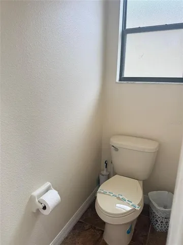 a living room with a large bed and a large window