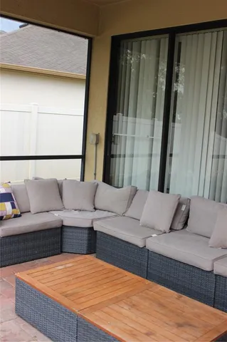 a view of a patio with a table chairs and a table
