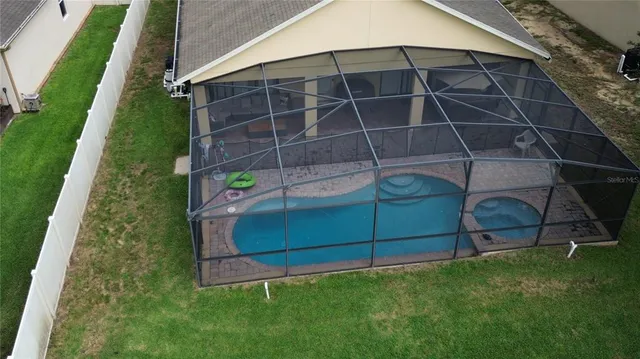 a living room with furniture and painting on the wall
